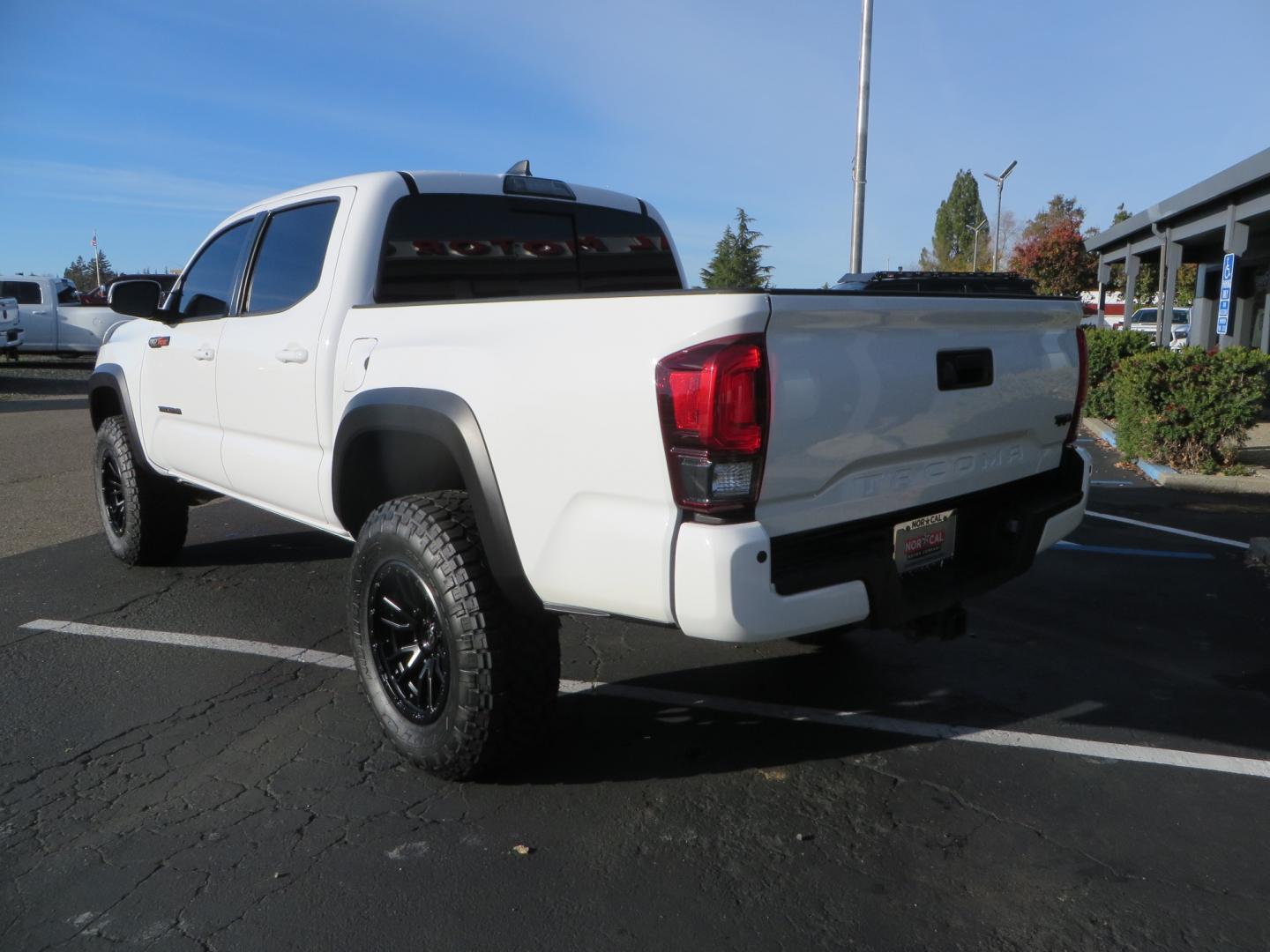 2019 White /black Toyota Tacoma TRD OFF-ROAD Double Cab (3TMAZ5CN4KM) with an 3.5L engine, automatic transmission, located at 2630 Grass Valley Highway, Auburn, CA, 95603, (530) 508-5100, 38.937893, -121.095482 - TRD Offroad 2WD sitting on Fox 2.5 remote reservoir DSC Coil-overs, Total Chaos upper control arms, Rigid Industries Dually side shooter leds, Fuel Rebel wheels, Nitto Ridge Grappler tires, and window tint. - Photo#6